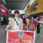 Two SkyNomad clients with the Canton Fair banner at the Guangzhou exhibition complex