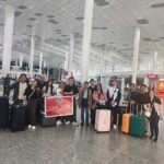 SkyNomad tour group with luggage at the airport departure hall before an international flight