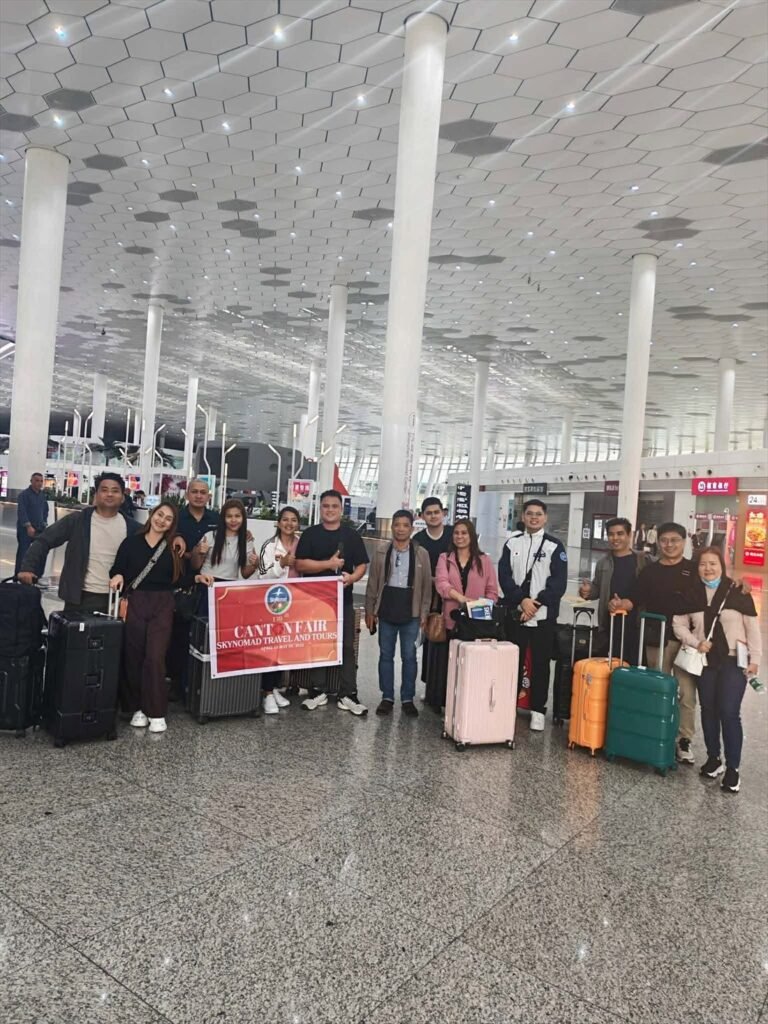 SkyNomad tour group with luggage at the airport departure hall before an international flight